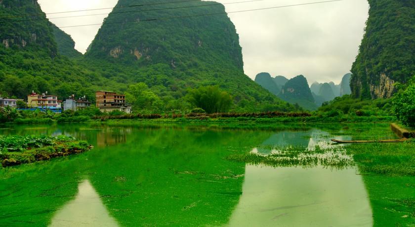 Отель Yangshuo Peaceful Valley Retreat Экстерьер фото